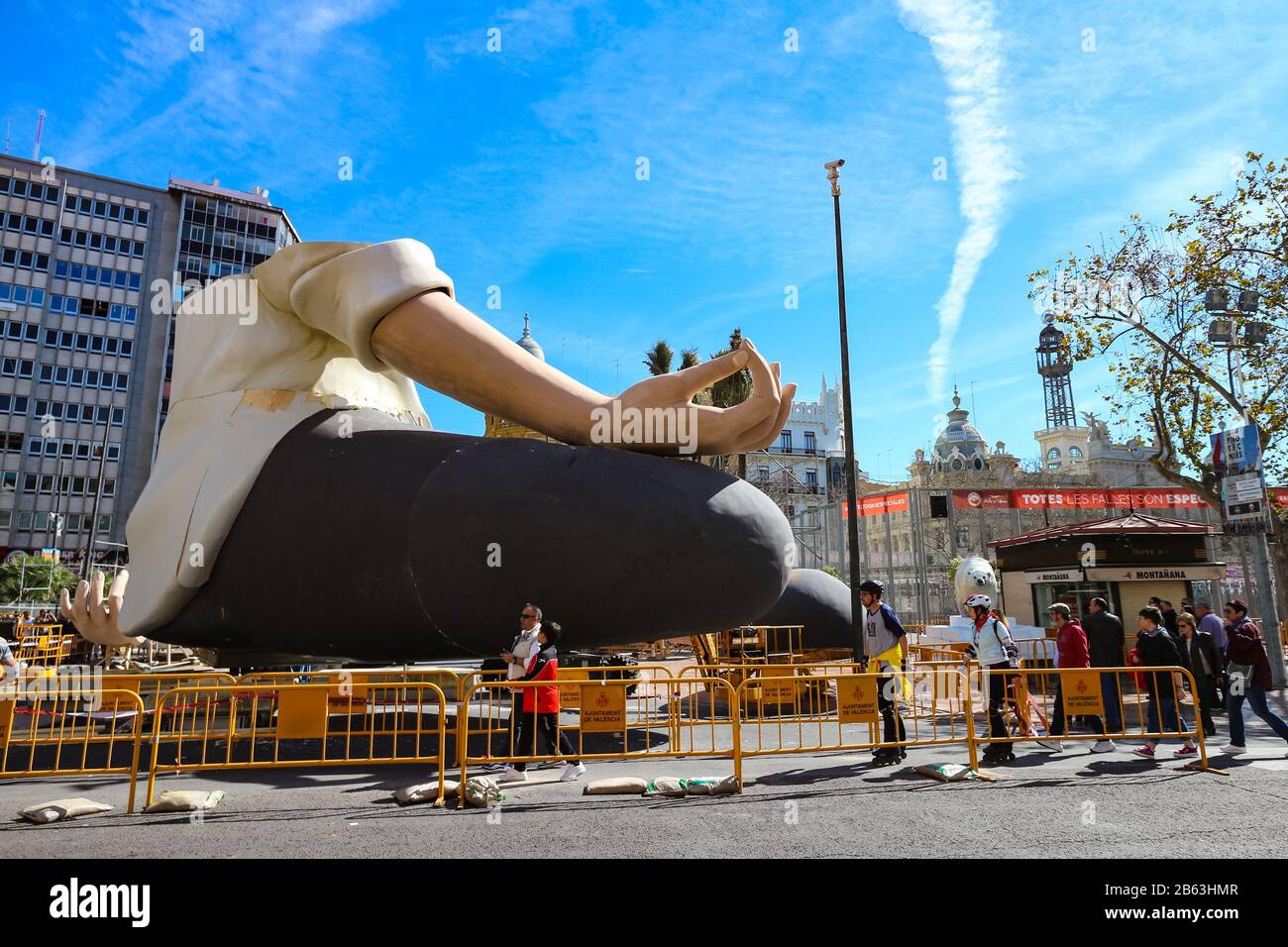 Unfinished yoga pose Falla on the Town Hall Square for Valencia's Fallas festival. These figurines are burned on the festival's last day, the 'Cremà'. Stock Photo