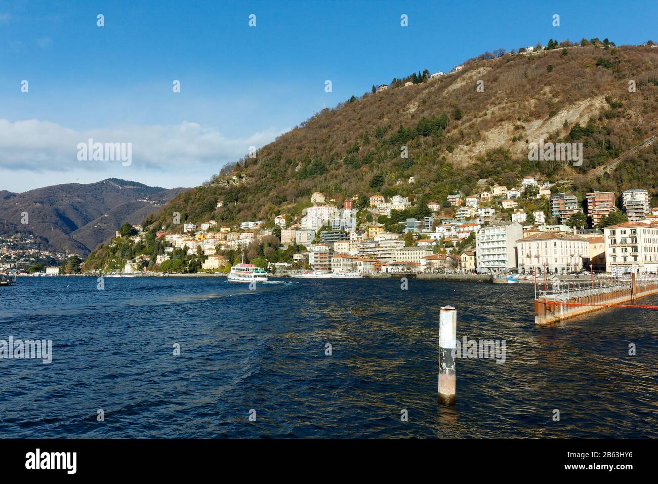 Lake como lago di como in italy italia with mountains and buildings on a hill Stock Photo