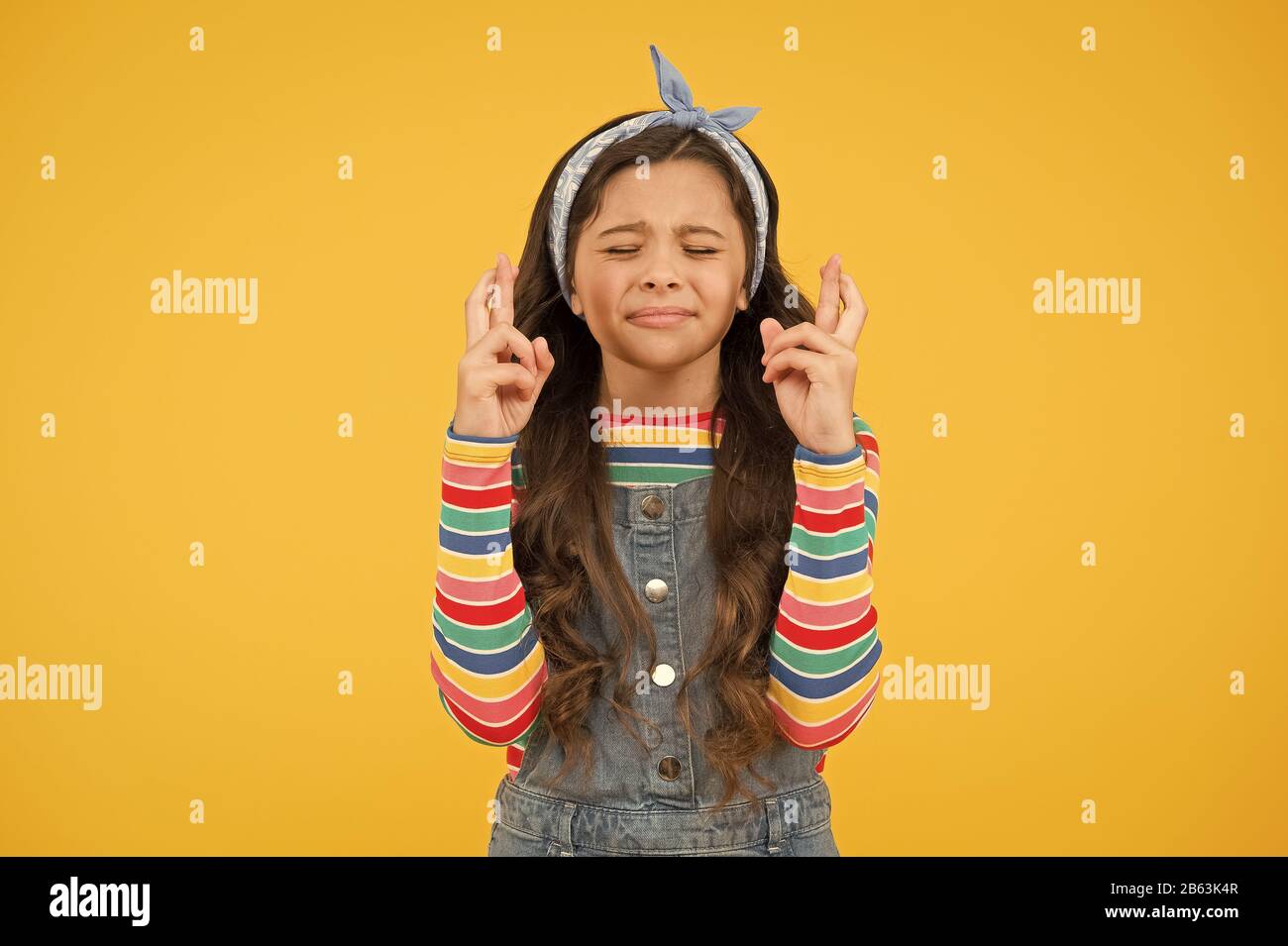 make a wish. retro girl crossed fingers. please. wait impatiently