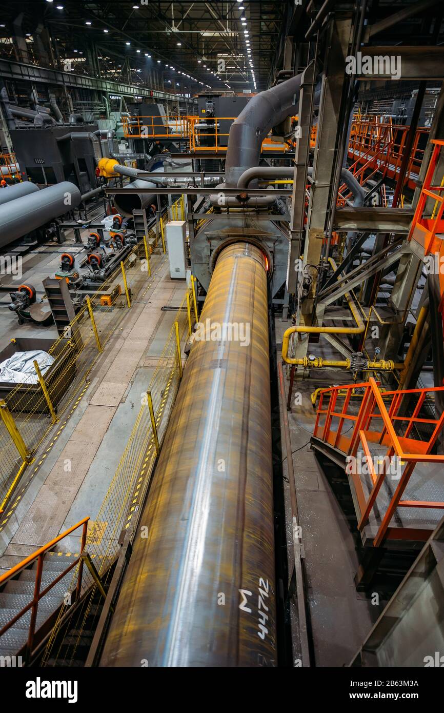 Pipe heating in induction oven for polymer coating Stock Photo Alamy
