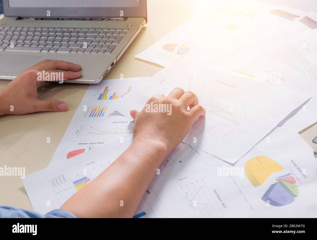 Financial paper charts, graphs and notebook on the table Stock Photo
