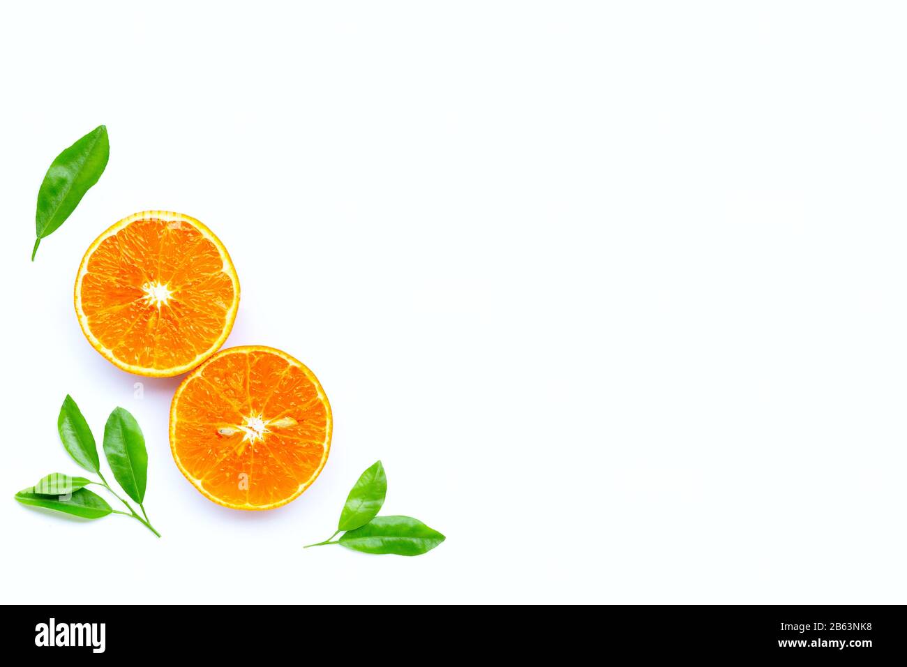 High vitamin C, Juicy orange fruit with leaves on white background. Copy  space Stock Photo - Alamy