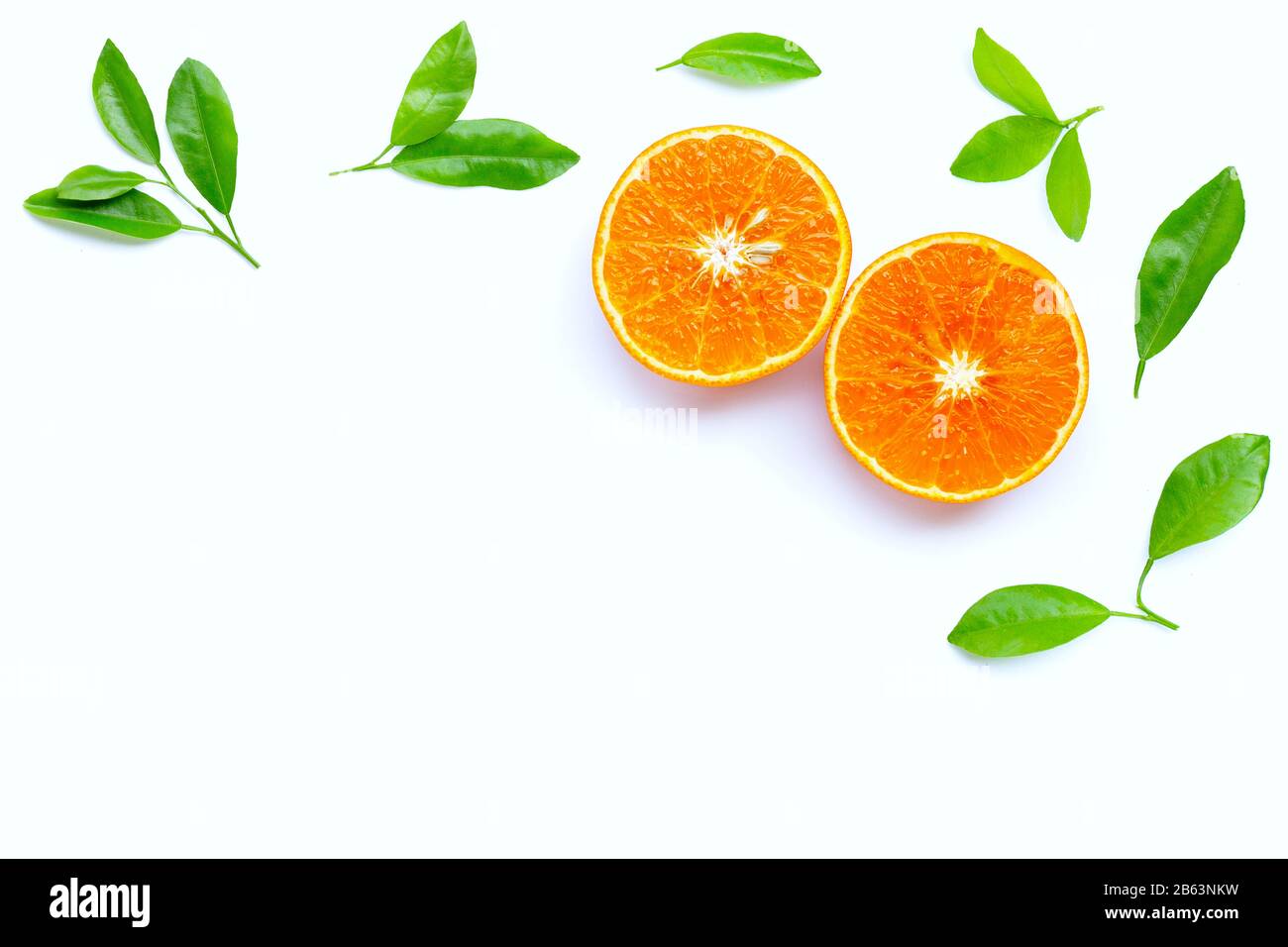 High vitamin C, Juicy orange fruit with leaves on white background. Copy  space Stock Photo - Alamy
