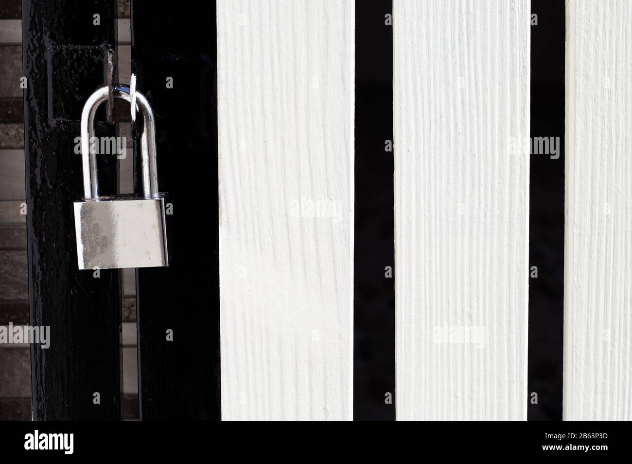 Padlock on a gate closeup. Stock Photo