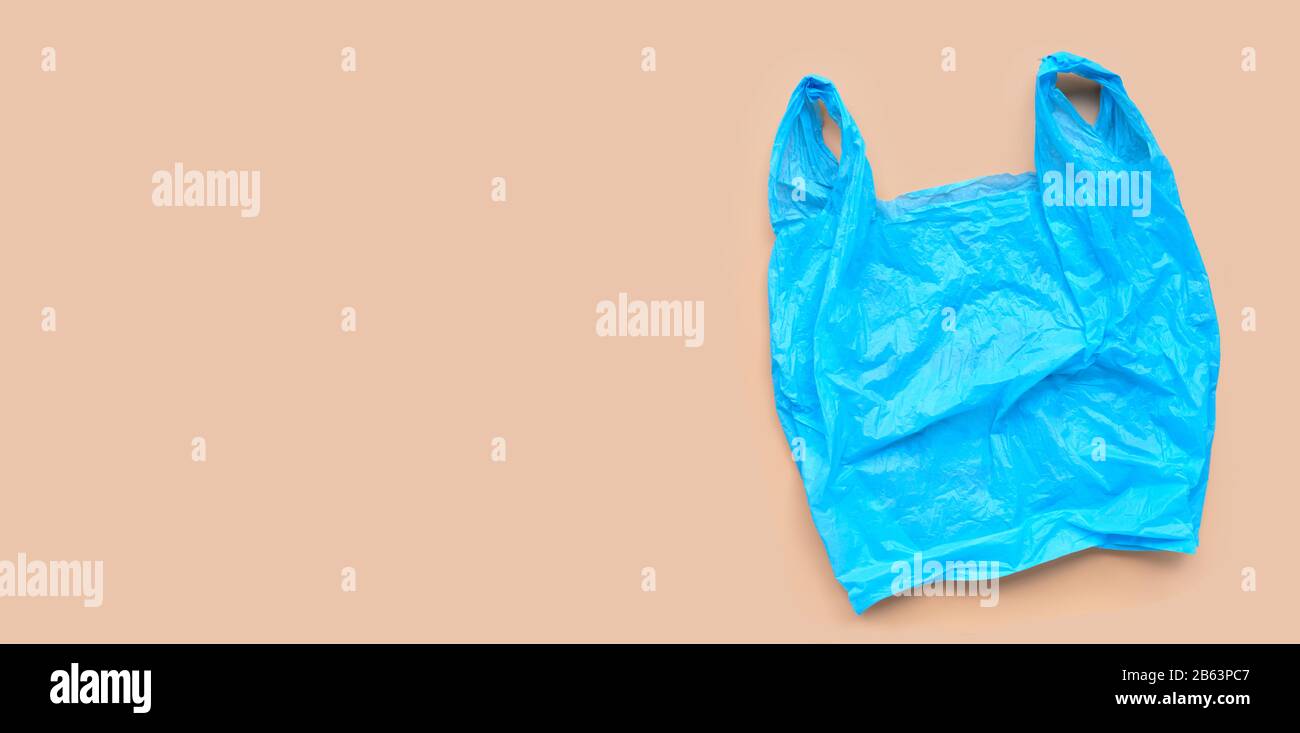 Blue plastic bag on browm background. Copy space Stock Photo Alamy