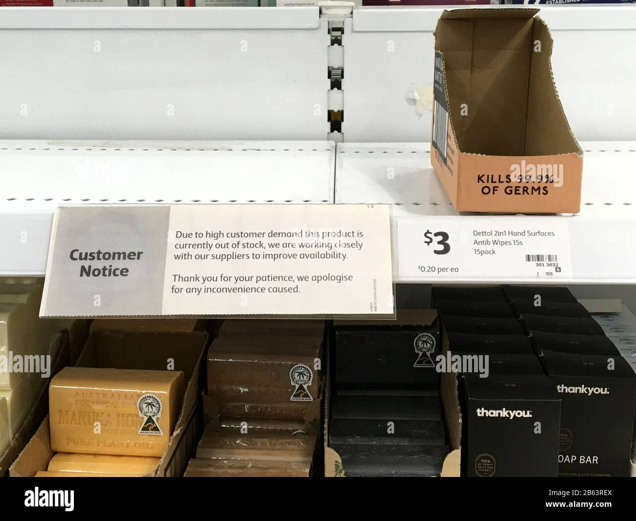 Rush buying empties supermarket shelves due to Corona Virus scare Stock Photo