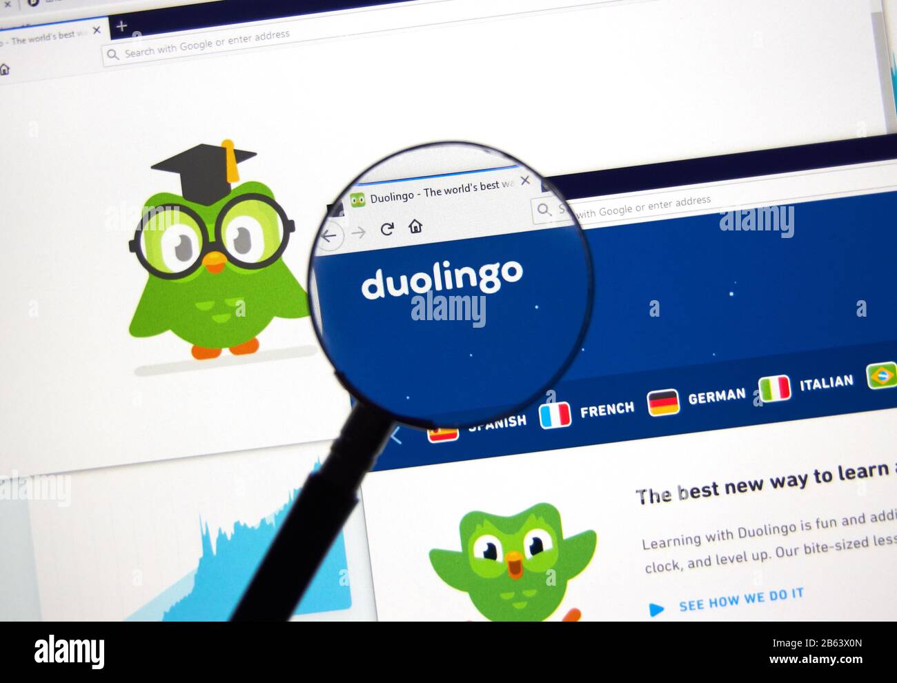 Montreal, Canada - March 08, 2020: Duolingo logo and application on official website under magnifying glass. Duolingo is a platform that includes a la Stock Photo