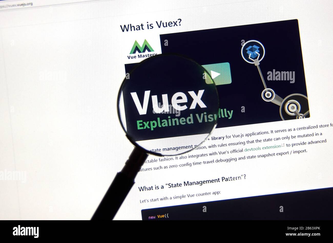 Montreal, Canada - March 08, 2020: Vuex logo on a screen under magnifying glass. Vue.js is an open-source Model view viewmodel JavaScript framework fo Stock Photo