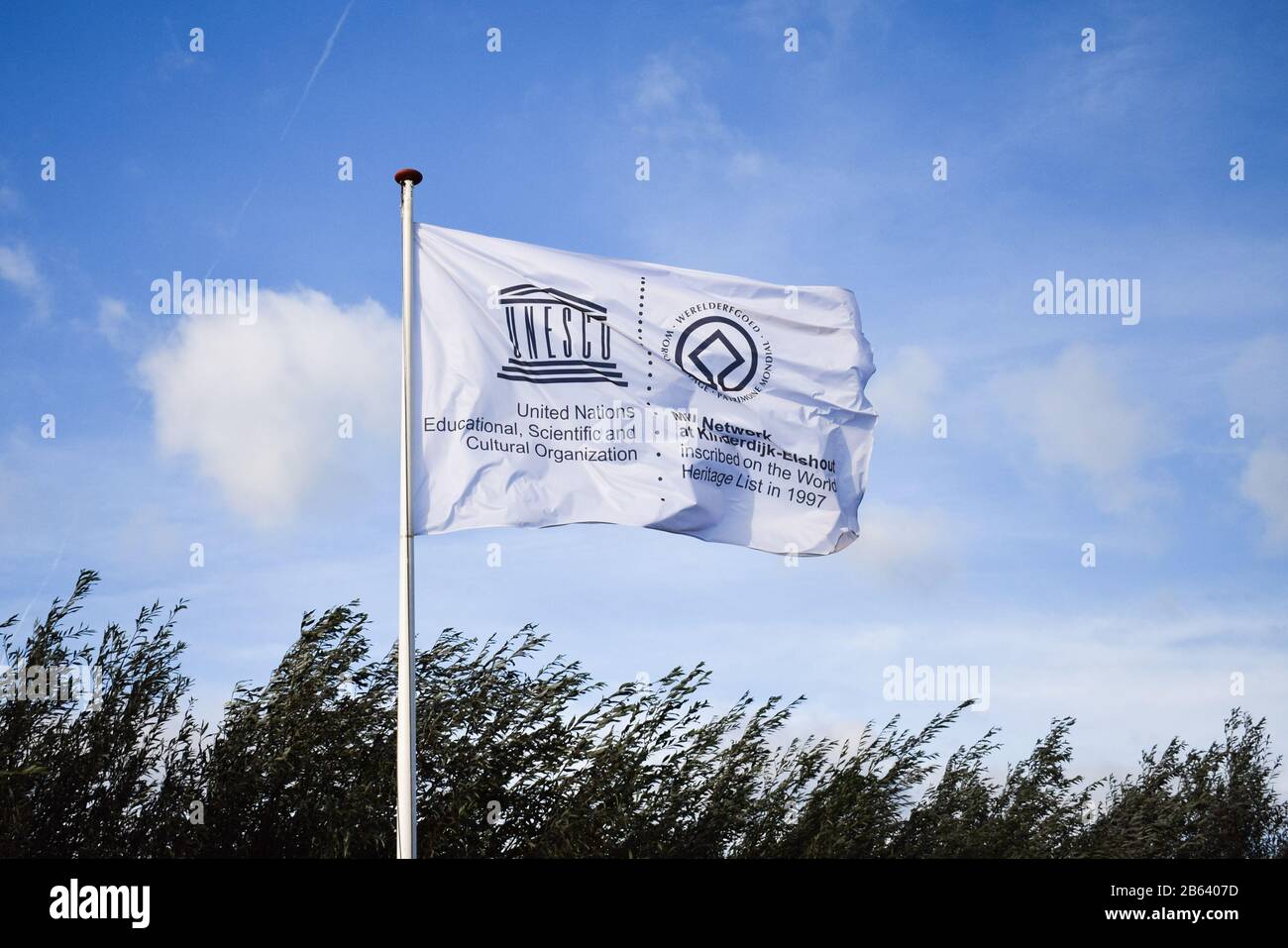 UNESCO white weaving flag, blue sky Stock Photo