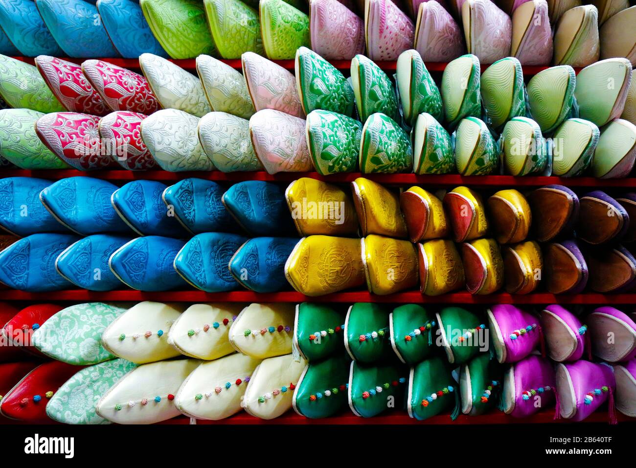 assortment of colorful moroccan babouche- slippers shoes-sold in market in the médina of marrakech Stock Photo