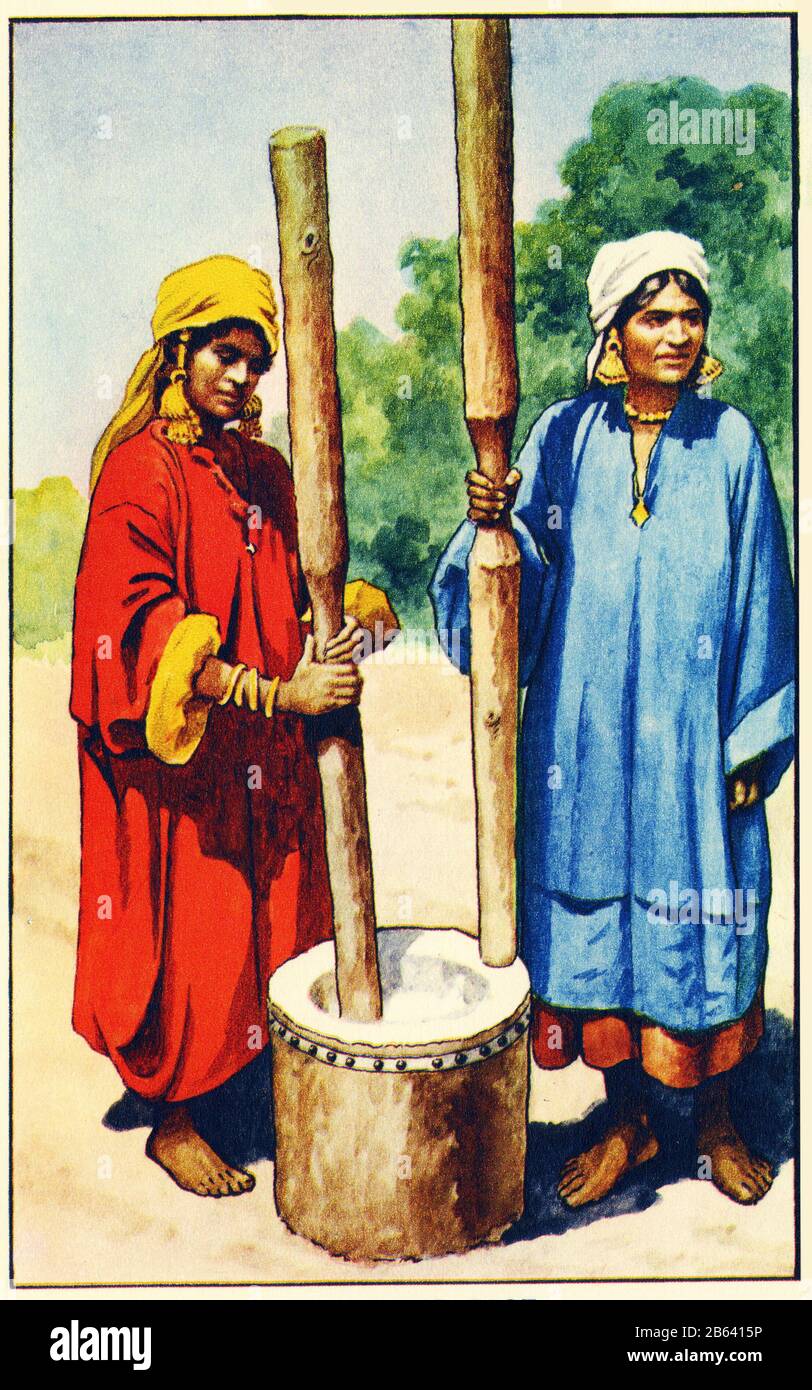 illustration of women pounding rice in India, from a set of school posters used for social studies, c 1930 Stock Photo