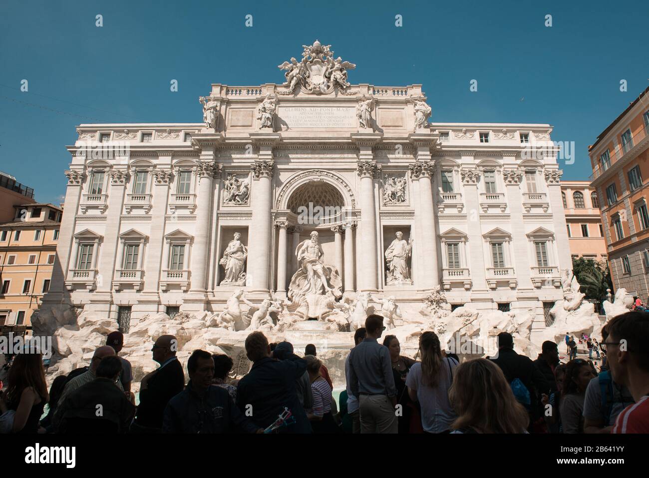Rome. Italy - March 21, 2017: Silhouettes of Tourists near Famous Trevi Fountain in Rome, Italy. Baroque Architecture and City Landmark. Stock Photo