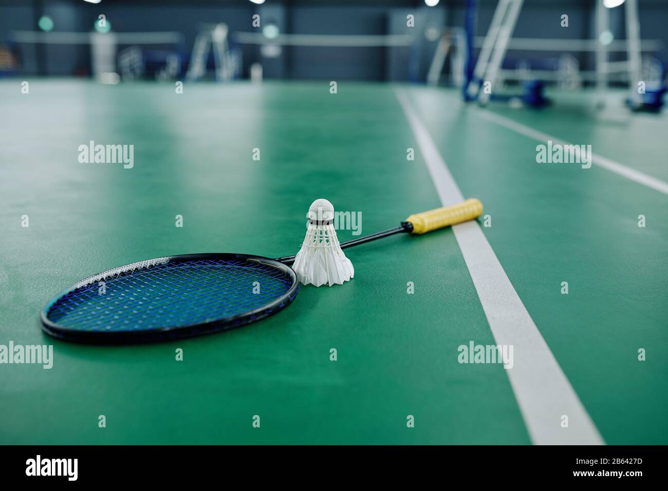 Shuttle Cock Racquet Shuttlecock and racquet on gymnasium floor, selective focus Stock Photo ...
