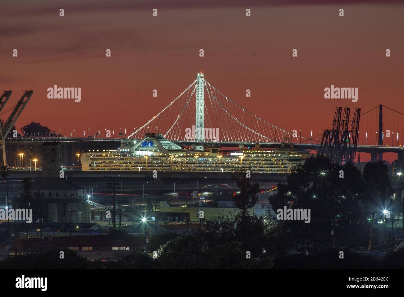 The Grand Princess cruise, carrying at least 21 people infected with the Caronavirus docked at the Port of Oakland on the evening after its arrival. Stock Photo