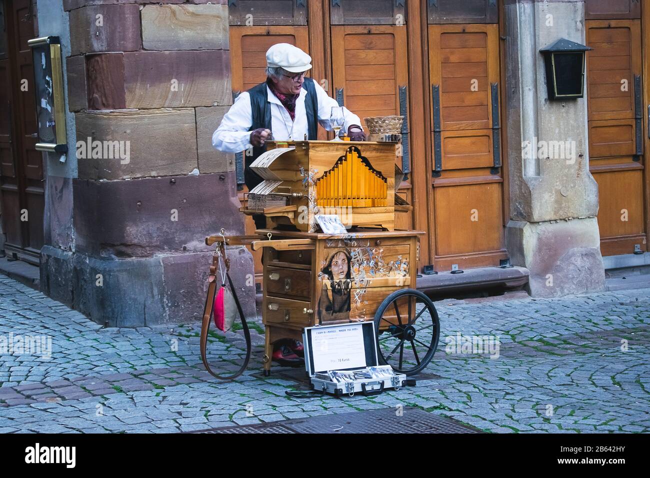 A man is playing on barrel organ Stock Photo