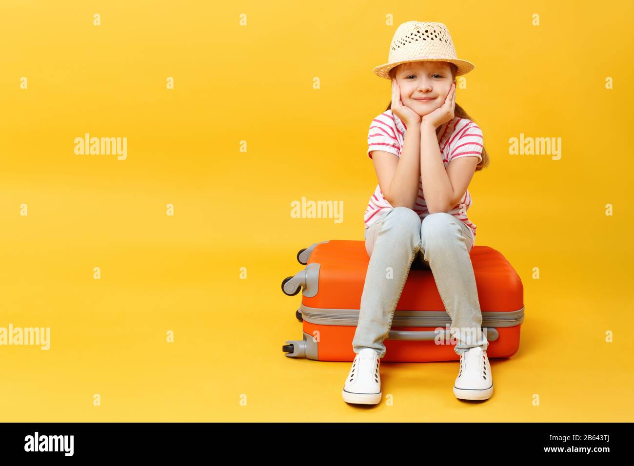 little girl with suitcase