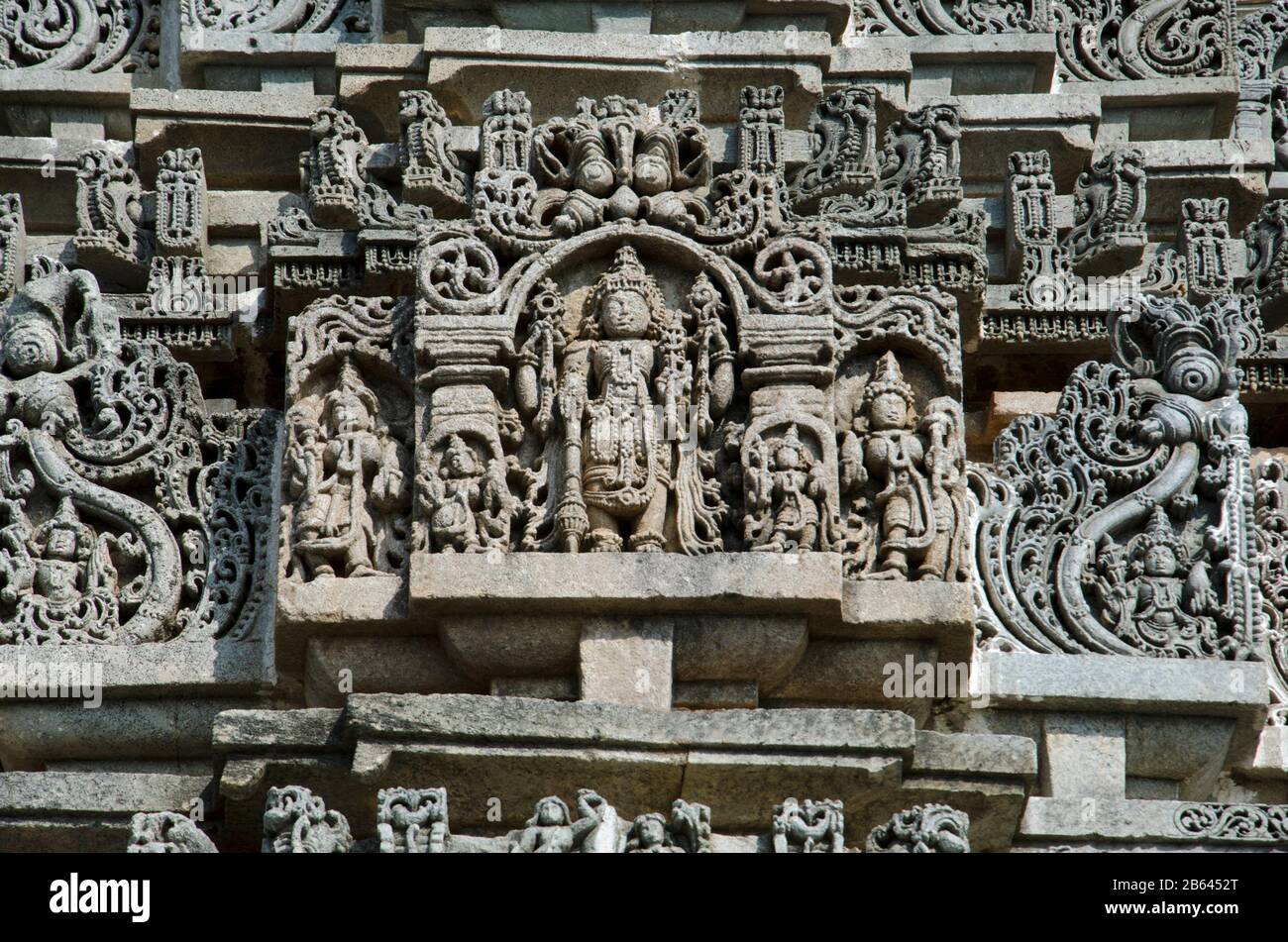 Carved idols on the outer wall of Veera Narayana temple, Belavadi, Karnataka, India Stock Photo