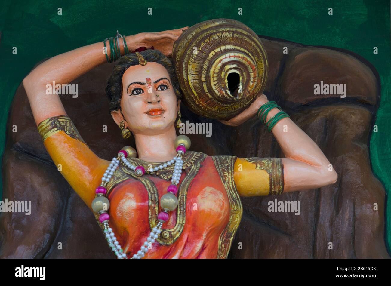 Colourful statue of a woman in temple, near Somanathapura, Karnataka, India Stock Photo