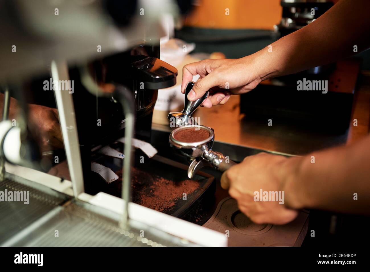 Metal tamper with metal handle on white background isolated. Barista Kit.  Barman tool for pressing down ground coffee, a tamper for a coffee machine  Stock Photo - Alamy