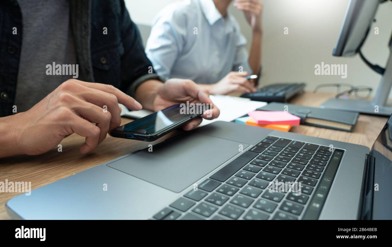 Collaborative work Software engineers website developer technologies or programmer working coding on startup ai application project on screen with par Stock Photo
