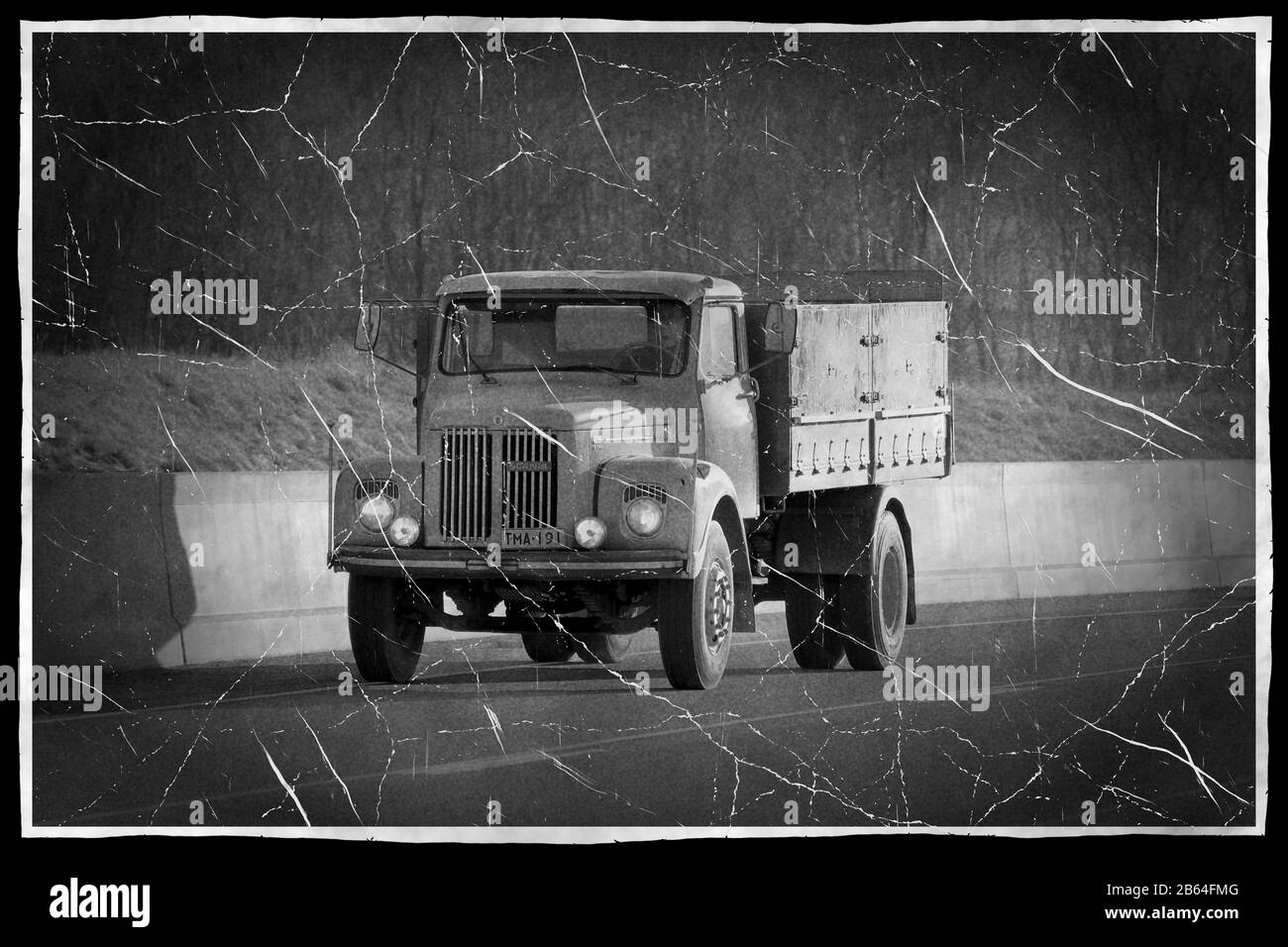 Classic Scania L85  truck on the road, old photo style, black and white conversion. Salo, Finland. March 6, 2020. Stock Photo