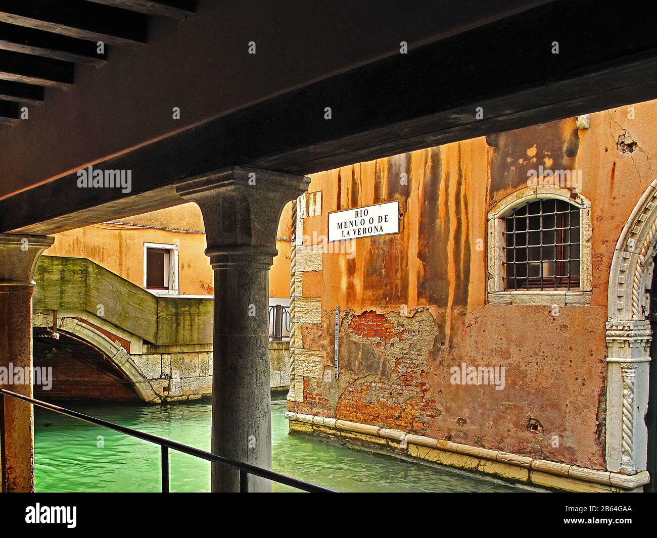 Covered walkway on the Canal street of Rio Menuo o De La Verona,Venice Italy Stock Photo