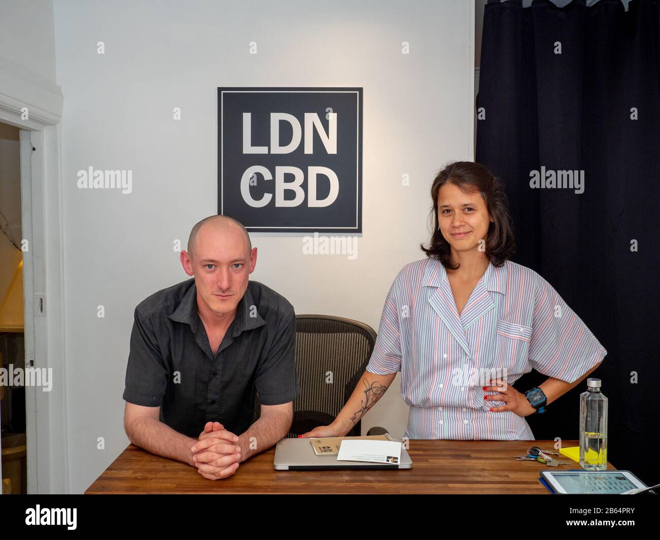 Marcus Lions and Jacqueline Chan working at the LDN CBD boutique in Camden Town. Stock Photo