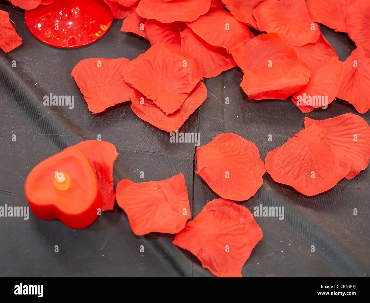 Close up imitation or artificial red roses leaves background Stock