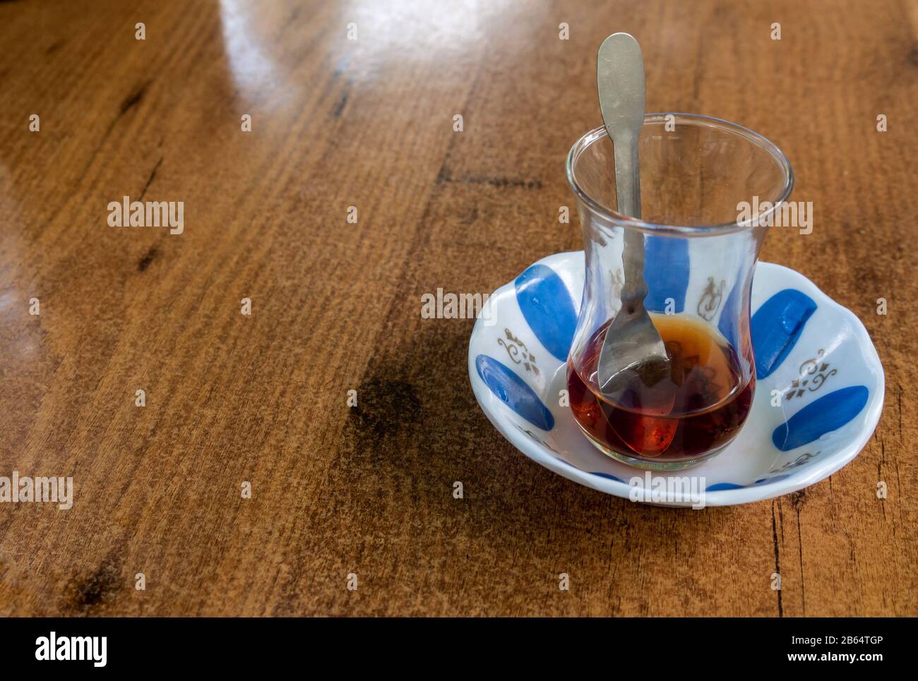 Drinking traditional turkish tea in the glass near seaside of izmir, Turkey Stock Photo