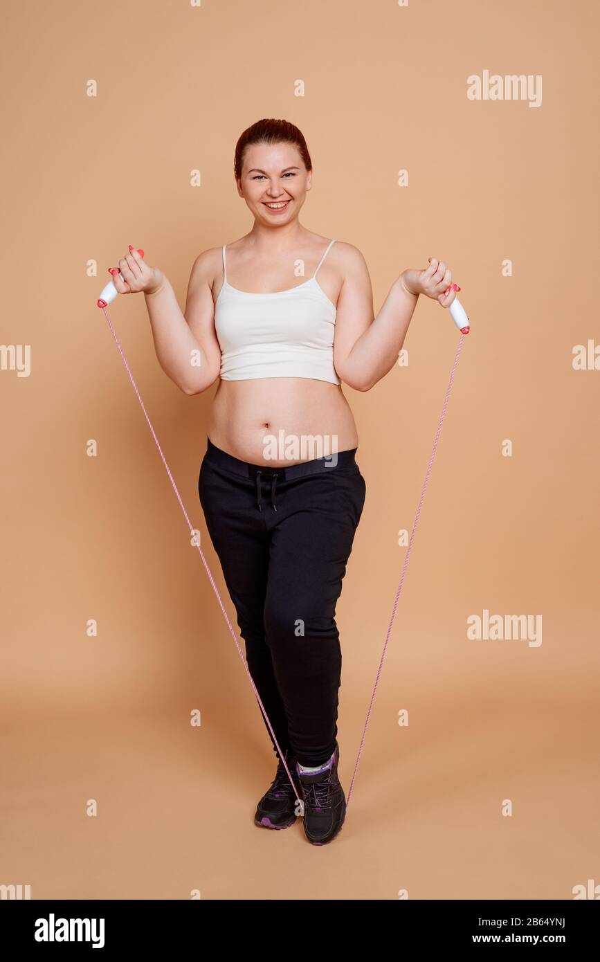 Woman Doing Jump Rope Exercises Fitness Workout For Weight Loss Stock Photo Alamy