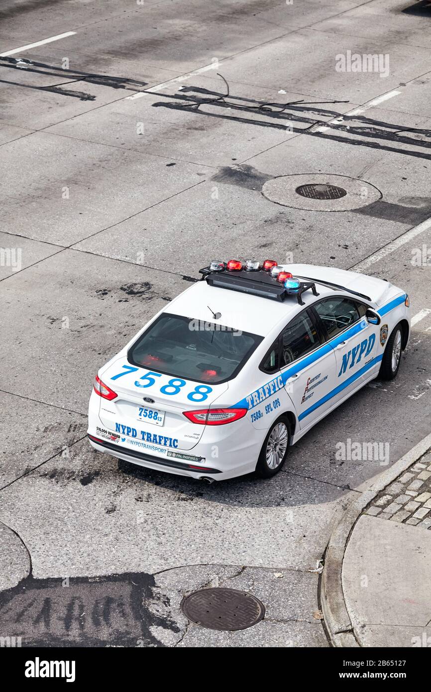 New York City, USA - June 28, 2018: NYPD Traffic Ford Fusion Hybrid vehicle on a street of Manhattan seen from above. Stock Photo