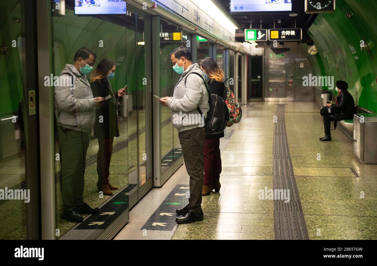 Hong Kong,China:18 Feb,2020.   2019-nCov in Hong Kong.Following advice from the government, the few people venturing out wear surgical masks on public Stock Photo