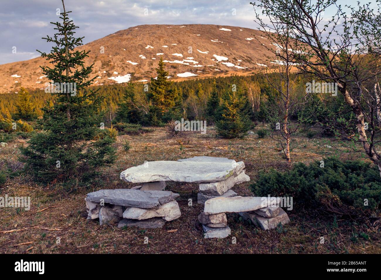 stone table and seat. Unusual solutions for camping in the mountains Stock Photo