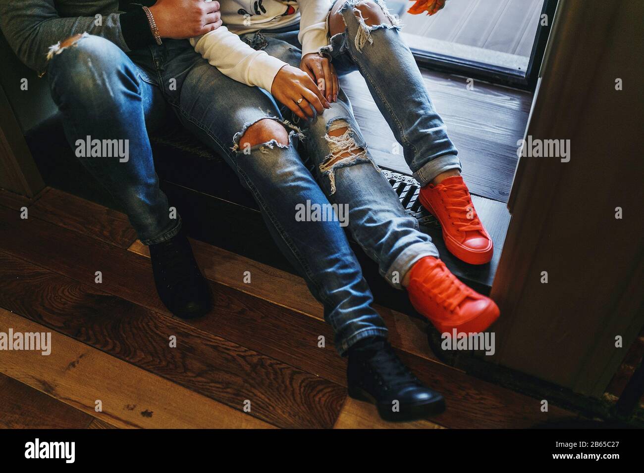 ripped jeans and sneakers