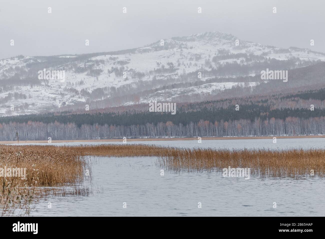 Talkas lake and early autumn snow, Ural mountains, Russia Stock Photo