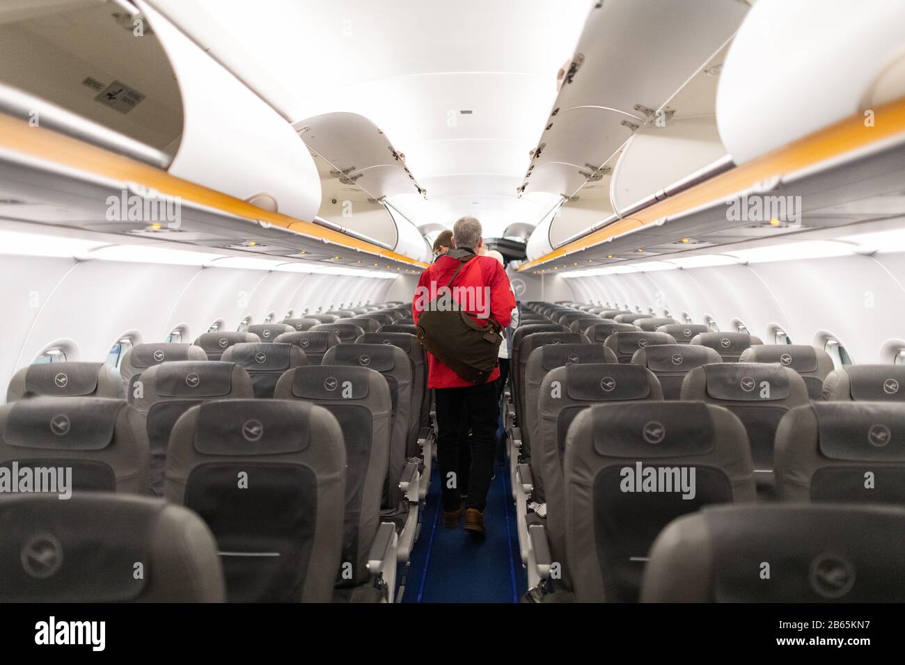 passengers disembarking Lufthansa plane Stock Photo