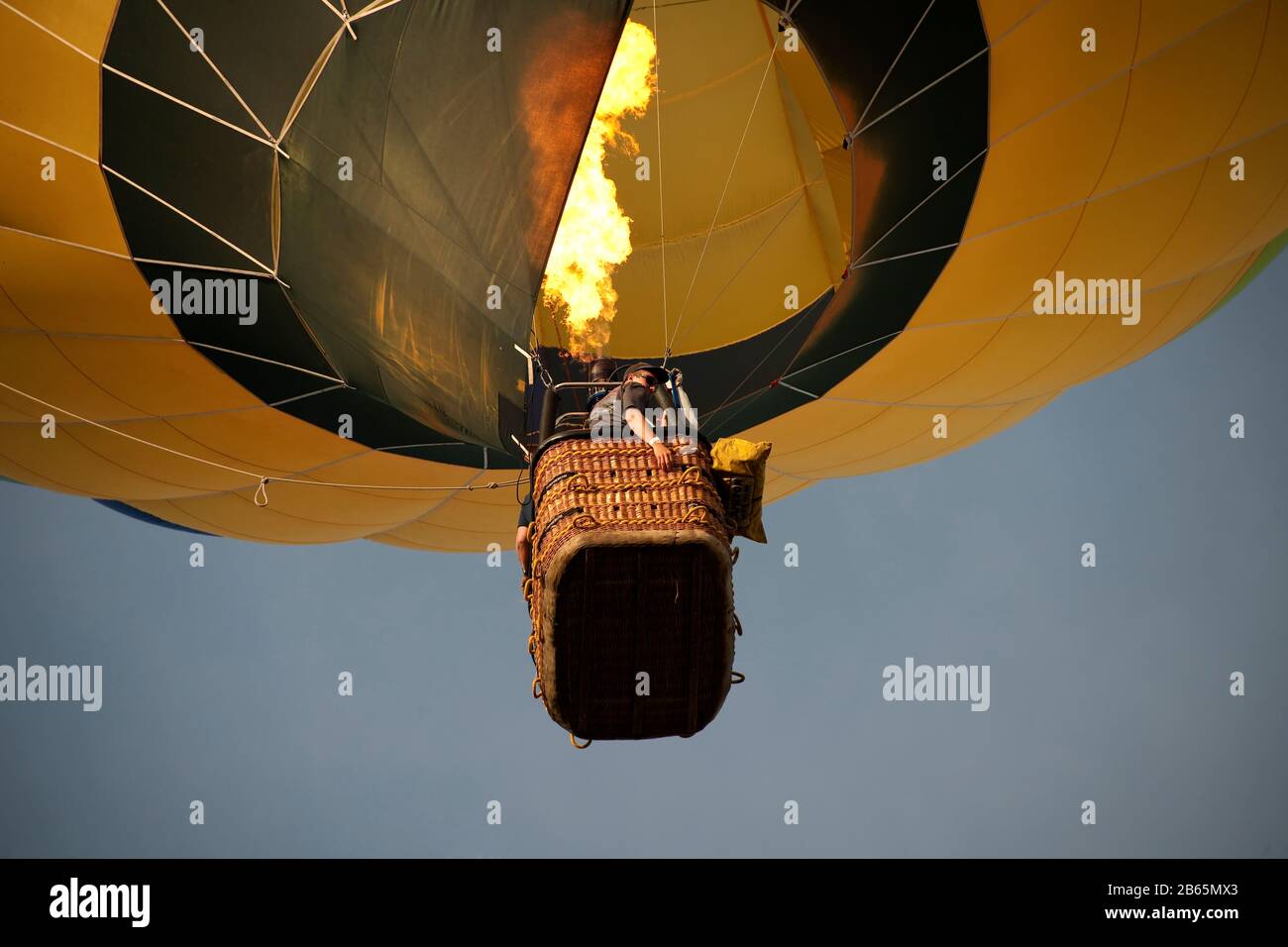 Ascending Hot Air Balloon With Burner Alight Stock Photo