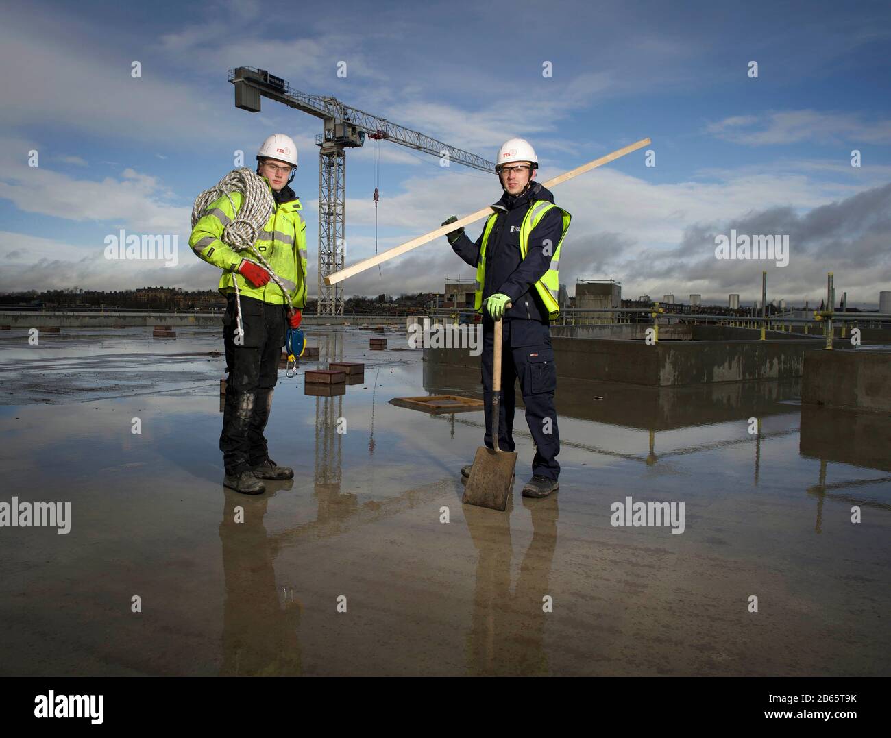 EDITORIAL USE ONLY (Left to right) Ryan Shalley 2nd year plumbing apprentice Multiplex and Alan Wood 2nd year building service apprentice Glasgow University on site at The University of Glasgow Research Hub development to launch the Open Doors initiative in Scotland. Stock Photo