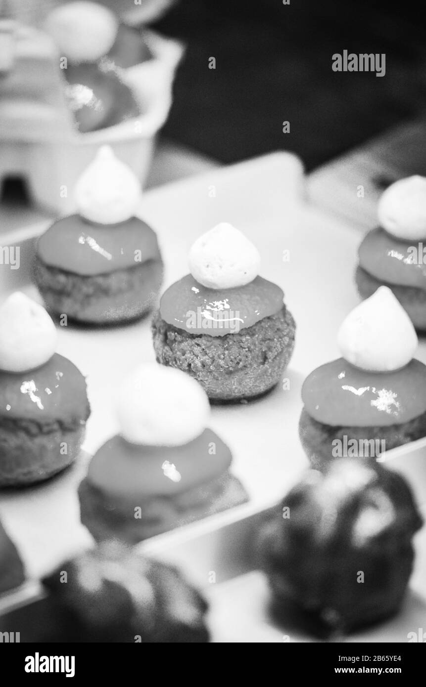 home made variety of mini cakes with tasty ingredients & fresh fruits