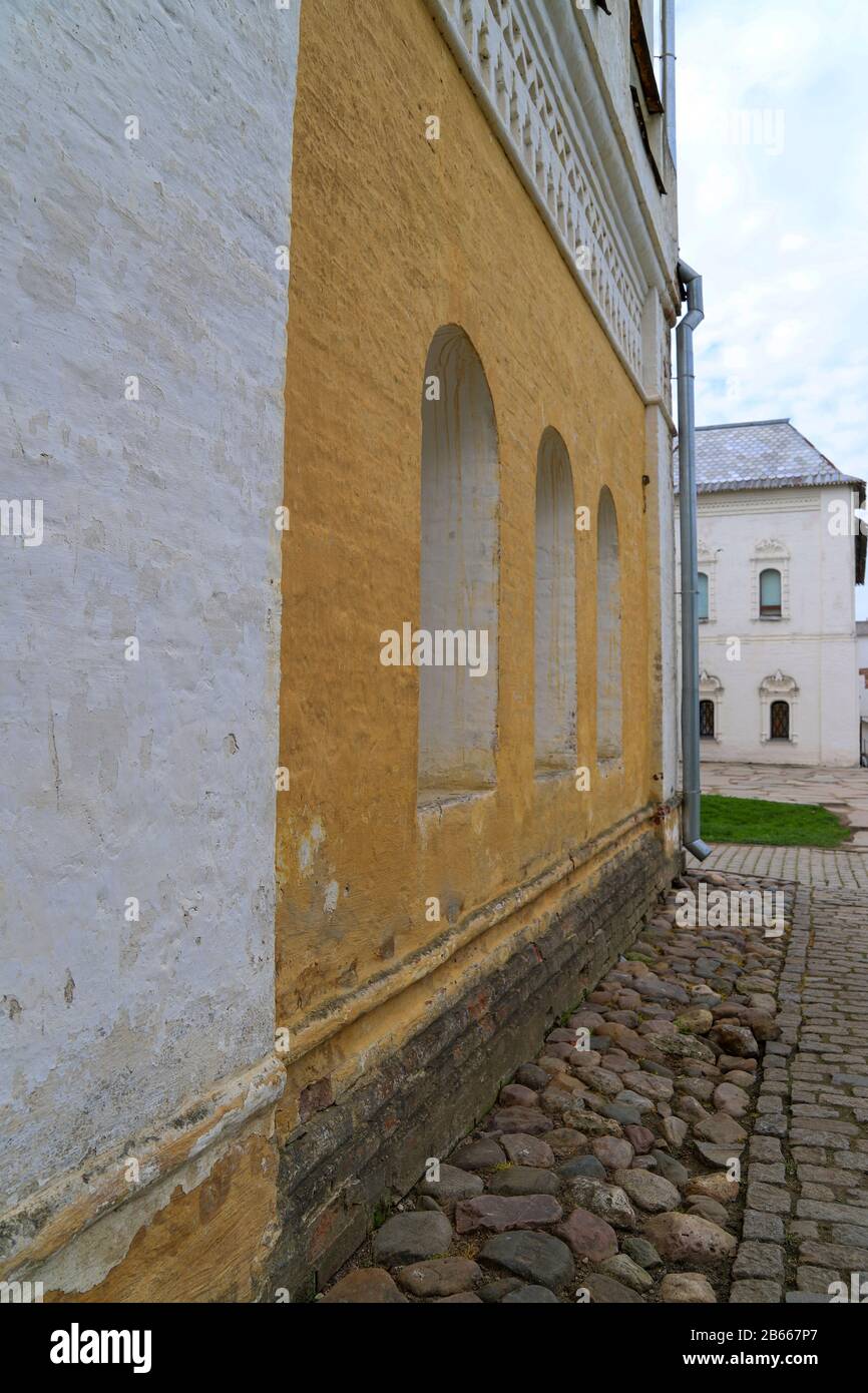 Street in old city, stone walls of aged buildings. Russian or European architecture Stock Photo