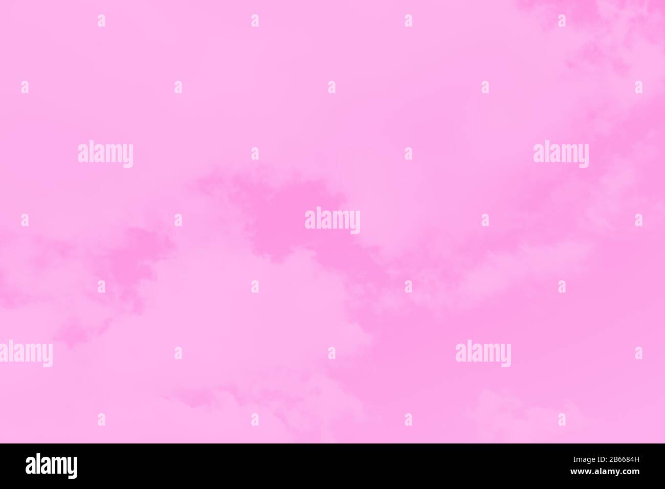 Pastel sky background. Pink sky with fluffy clouds Stock Photo - Alamy