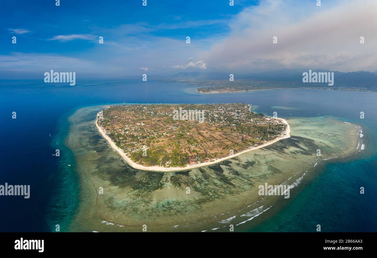 Panoramic aerial view of a beautiful tropical island surrounded by coral reef (Gili Air, Indonesia) Stock Photo