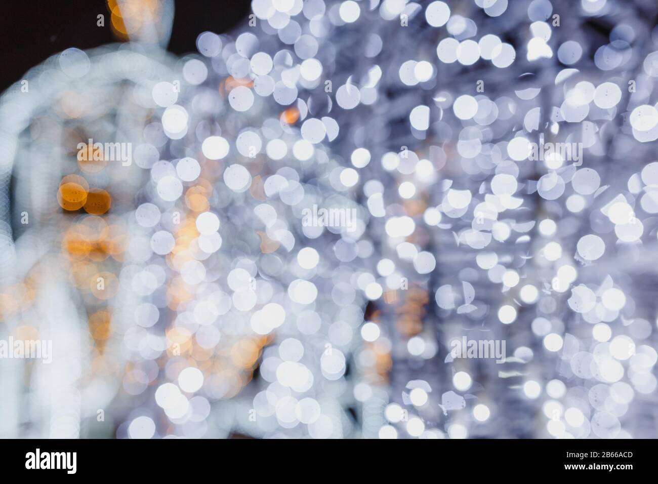Christmas lights on the street at night. Blurred background Stock Photo
