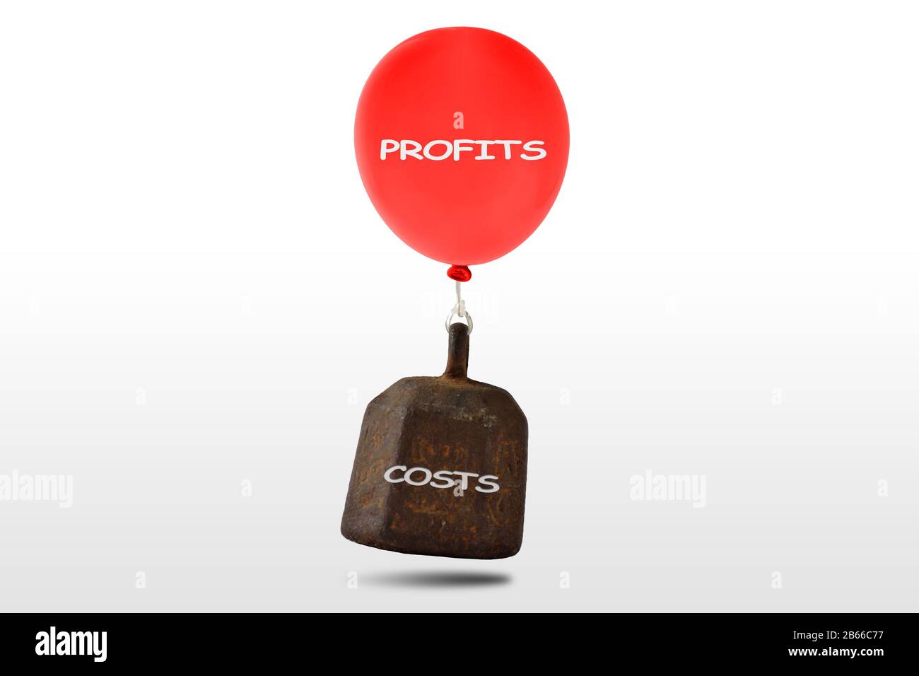 Heavy iron weight with the written Costs and red balloon with the written Profits floating on white background - Concept of finance and economy Stock Photo