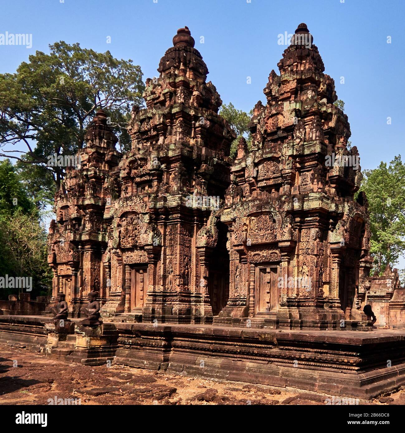 Cambodia, in north of Angkor, Cambodia. Banteay Srei (or Banteay Srey, meaning Citadel of women) is a 10th century Cambodian temple, built largely of red sandstone, and dedicated to the Hindu god Shiva. Angkor used to be the seat of the Khmer empire, which flourished from approximately the ninth century to the thirteenth century. The ruins of Angkor temples are a UNESCO World Heritage Site. Stock Photo