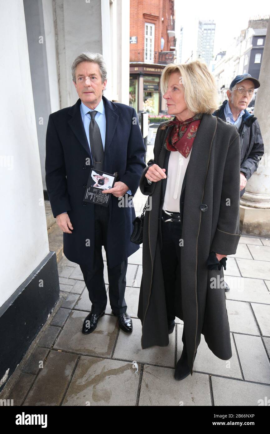 Nigel Havers and his wife Georgiana Bronfman arrive for the memorial service for photographer Terry O'Neill at The Grosvenor Chapel, in London's Mayfair district. Stock Photo