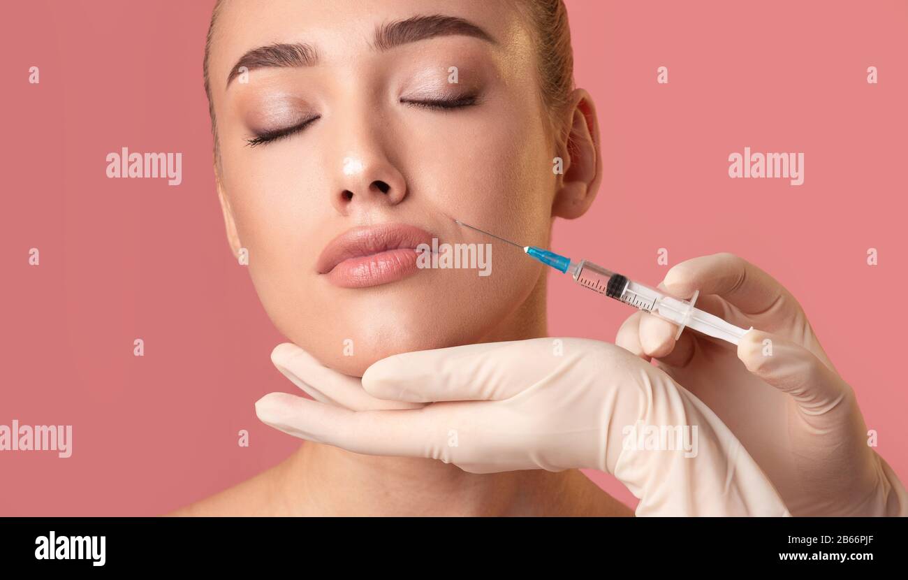 Beautiful Lady Receiving Beauty Lips Injection On Pink Background