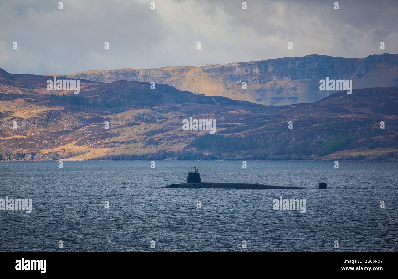 Royal Navy submarine with the Isle of Raasay Scotland in the background Stock Photo