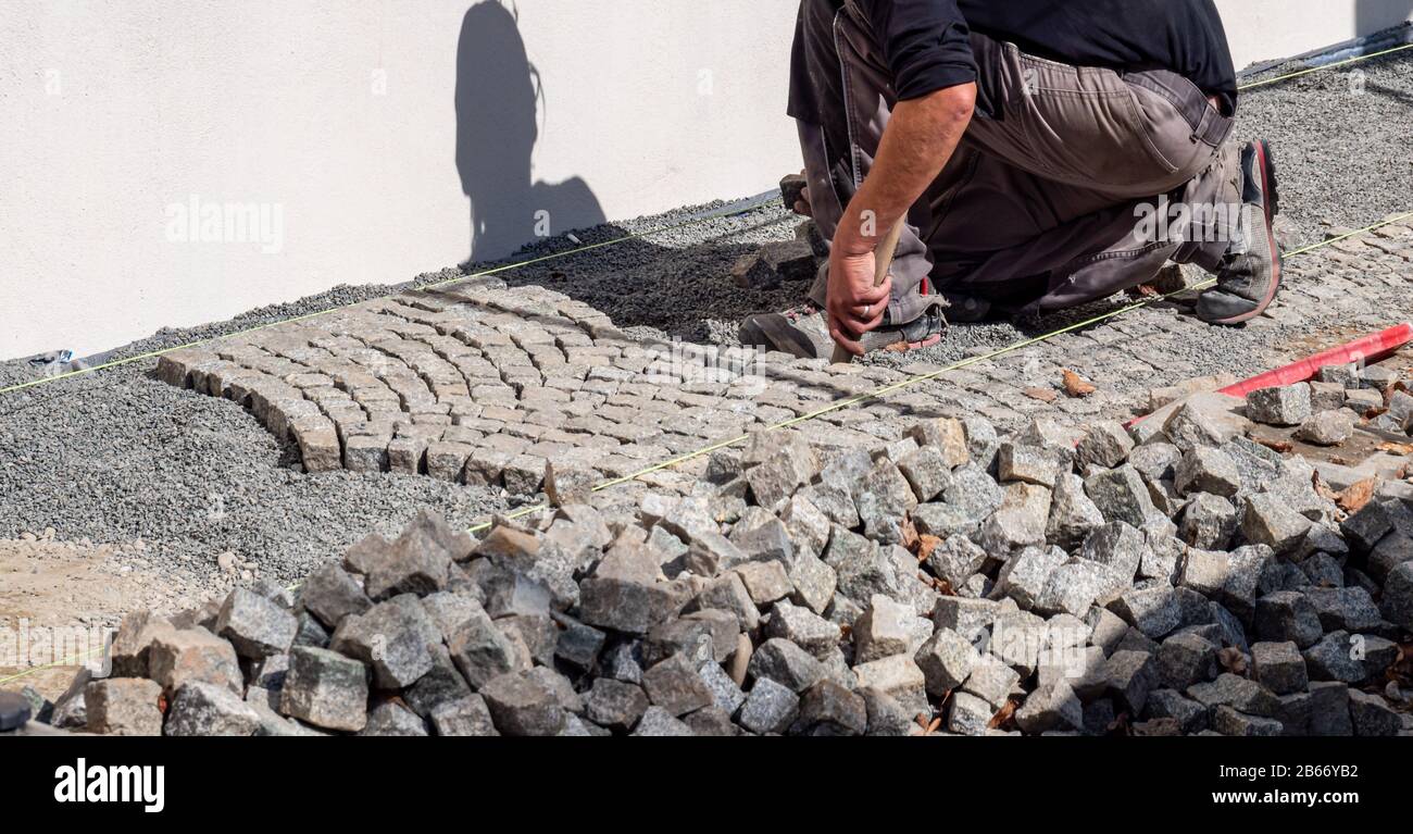 Panorama stone setters, path construction, paving stones Stock Photo