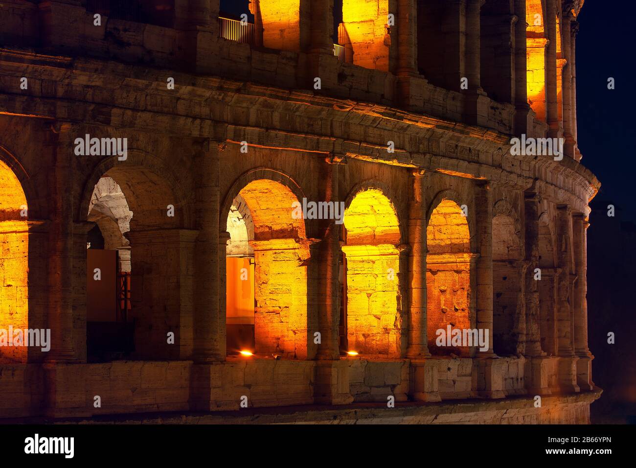 illuminated Colosseum arches in the nighttime Stock Photo